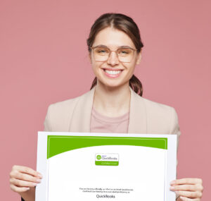 Certified woman holding QuickBooks certificate